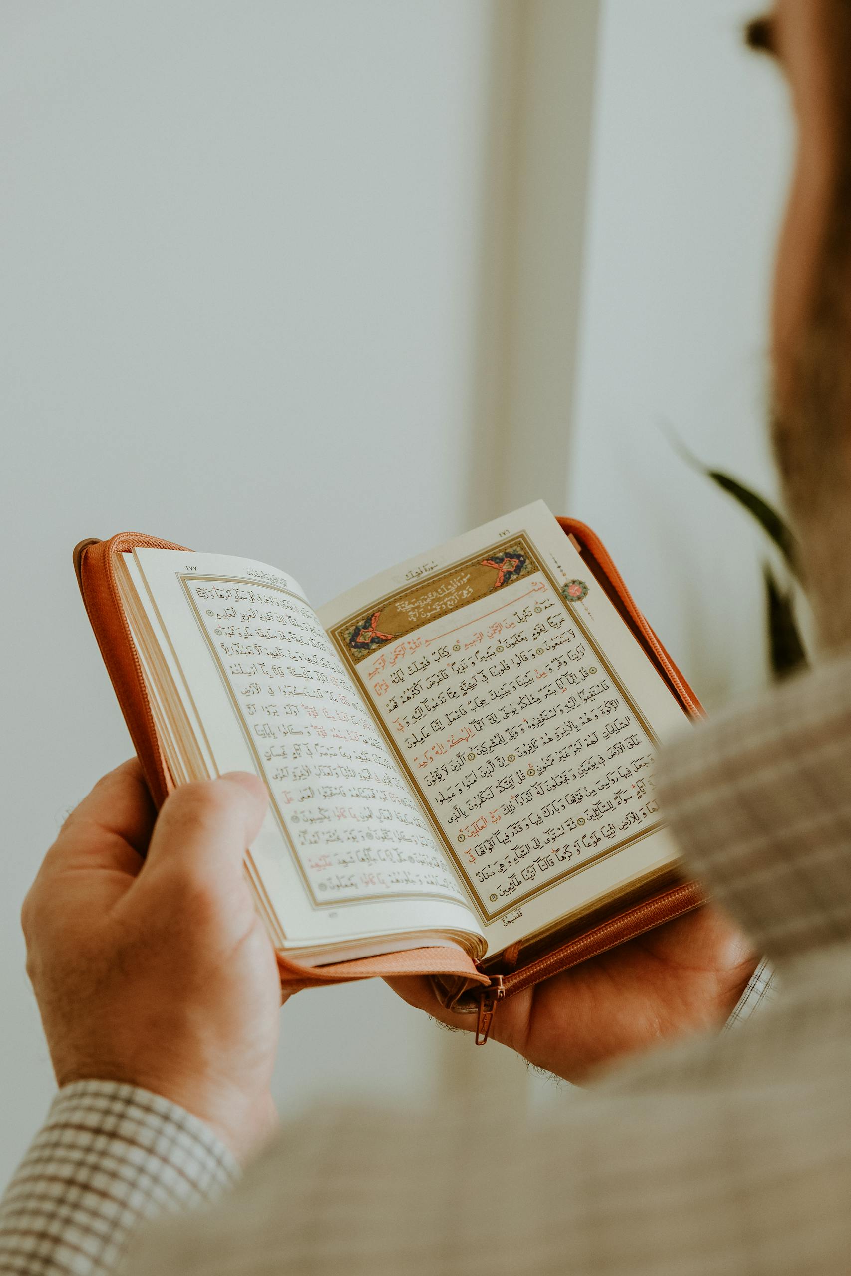 Back View of Man Reading Koran