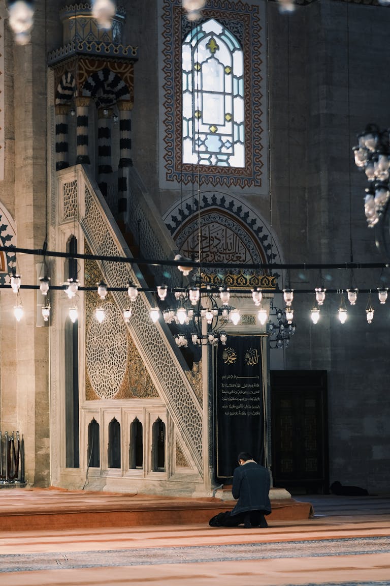 Man Praying in Traditional Mosque