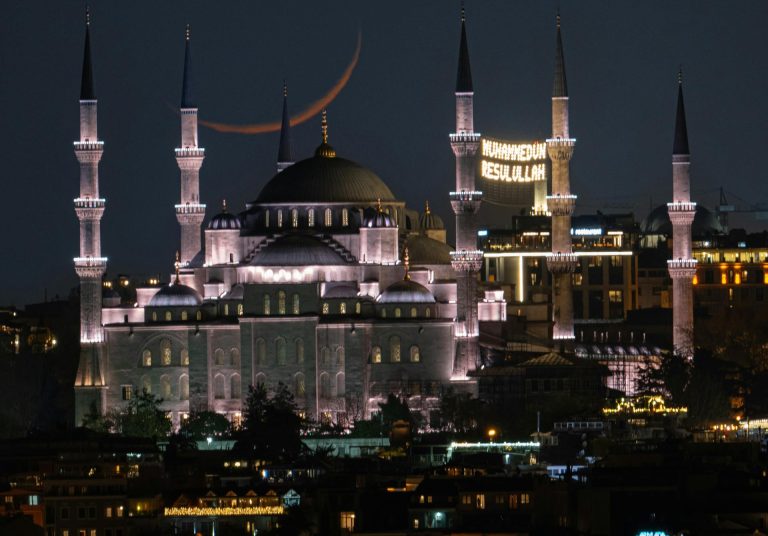 Stunning night view of the illuminated Blue Mosque with minarets in Istanbul, Turkey.
